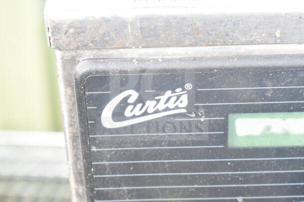 Curtis D60GT12A000 countertop coffee machine with hot water dispenser, visible logo, shows some wear, 115V, 1 phase.