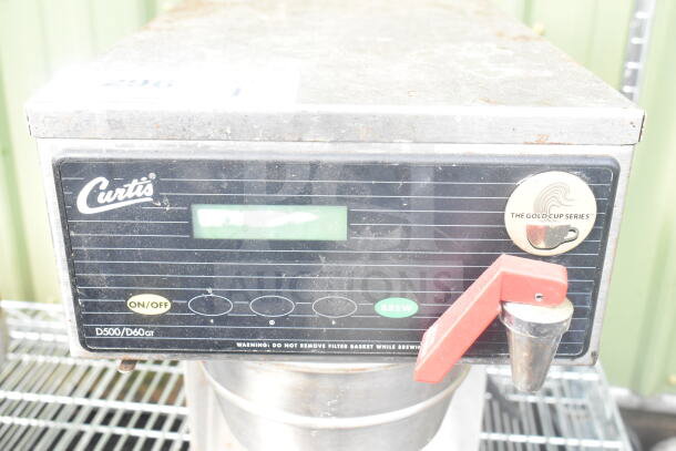 Curtis D60GT12A000 countertop coffee machine with hot water dispenser, 115V, 1 phase. Features on/off and brew buttons.