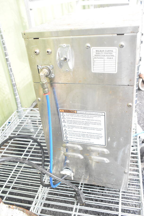 Curtis D60GT12A000 countertop coffee machine with hot water dispenser, 115 volts, 1 phase. Visible warning and inspection labels.