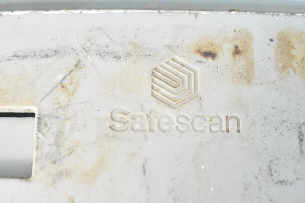 Safescan TA-8025 fingerprint clock-in system, visible logo and wear.