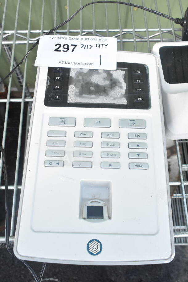 Safescan TA-8025 fingerprint clock-in system, keypad visible, used condition, auction label attached.