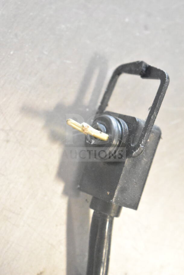 Close-up view of a severed black cord with exposed wiring, suggesting potential repair. No visible brand or model markings.