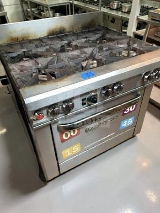Southbend S36D 36" commercial 6-burner natural gas range, standard oven, 203,000 BTU, tested, operational, shown in kitchen setting.