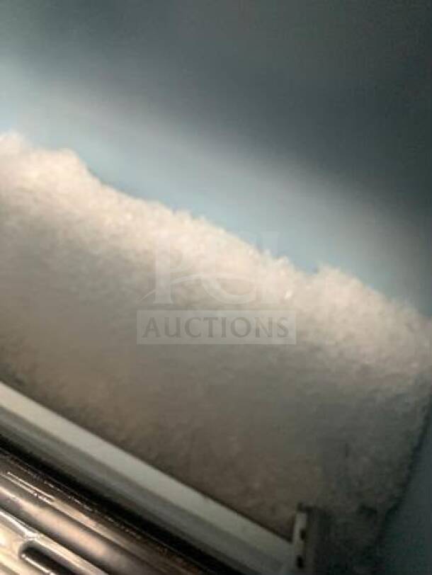 Follett Sentry Series Ice Storage Bin with Pull-Out Dispenser, superior condition, ice-filled interior, Manitowoc head, 1500 lb/day.