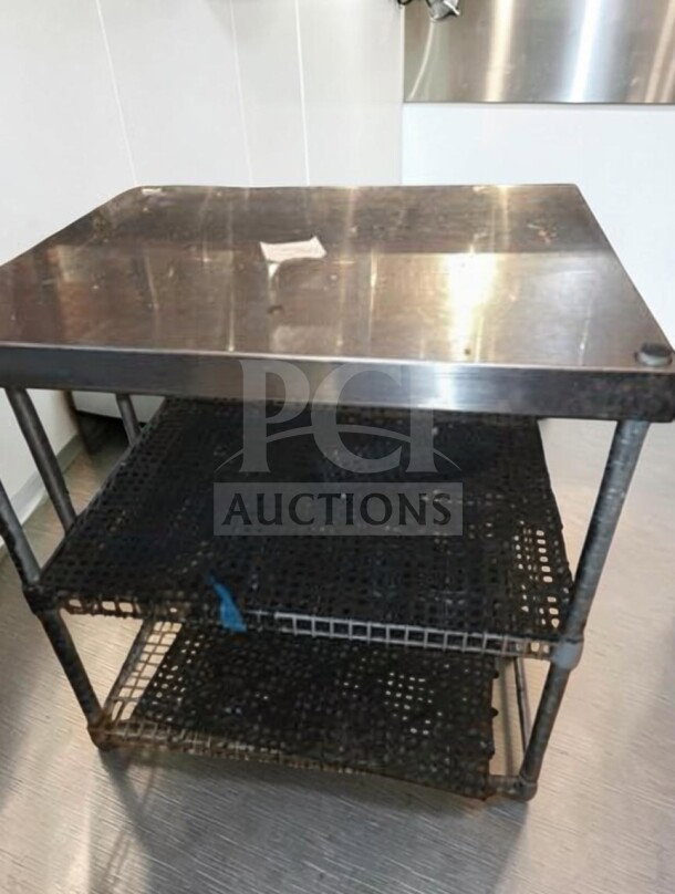 Stainless steel work table, 34"x30"x26", with wire undershelf. Ideal for commercial use, high-quality condition.
