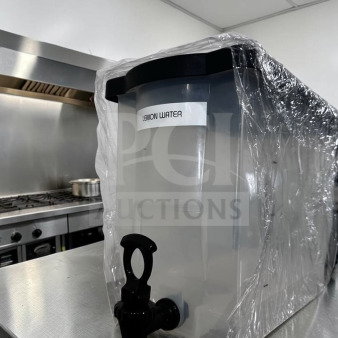 Like-new plastic cold juice dispenser with spigot; labeled "Lemon Water"; countertop ready, unbranded model MIS-S-DISP-1227.