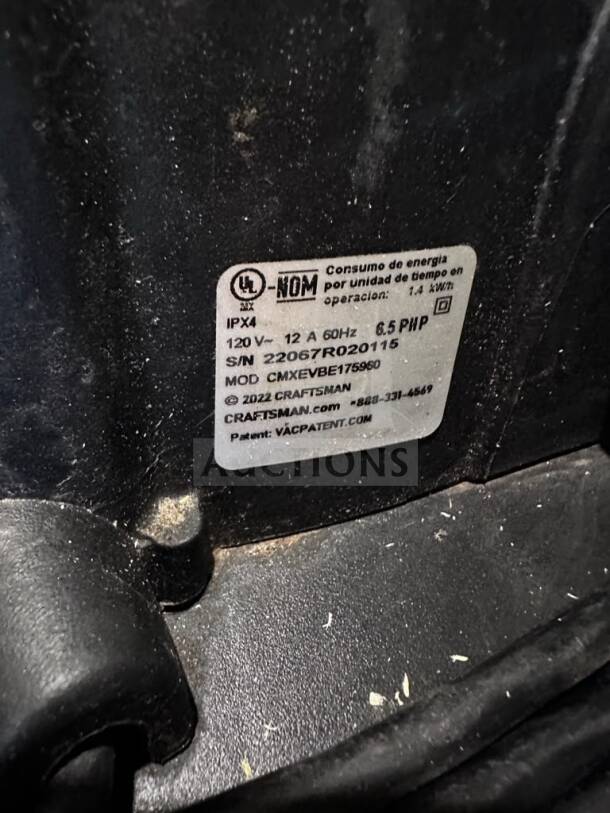 Label on Craftsman CMXEVBE17595, 16 Gallon 6.5 Peak HP Wet/Dry Vacuum, showing model, serial number, and power details.