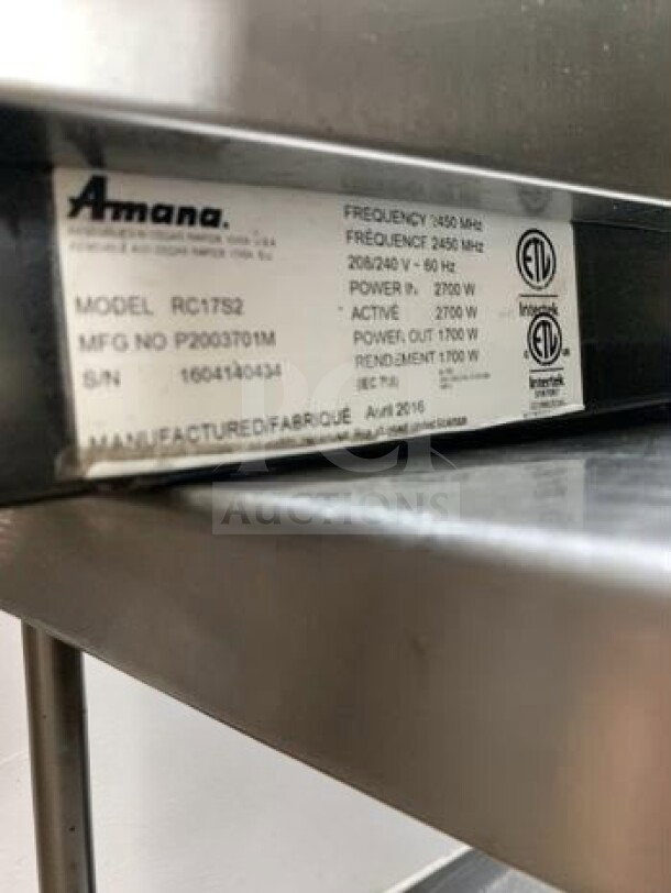 Amana RC17S2 commercial microwave, stainless steel, 1700W, 208/240V, ETL listed. Model and specs label visible.