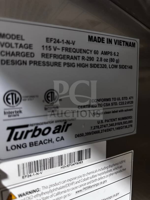 Label on Turbo Air EF24-1-N-V Reach-In Freezer; states 115V, R290 refrigerant, made in Vietnam; includes safety warnings.