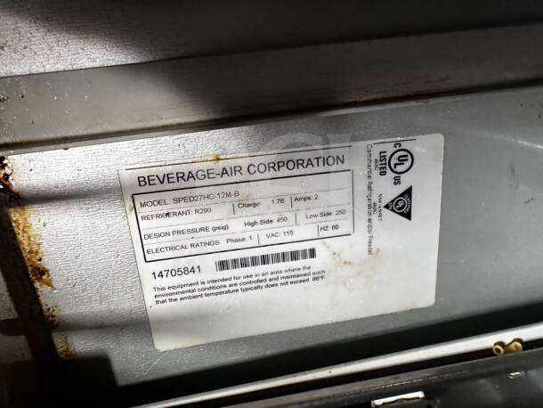 Beverage-Air SPED27HC-12M-B label showing model, refrigerant type R290, UL and NSF certifications, and electrical ratings.