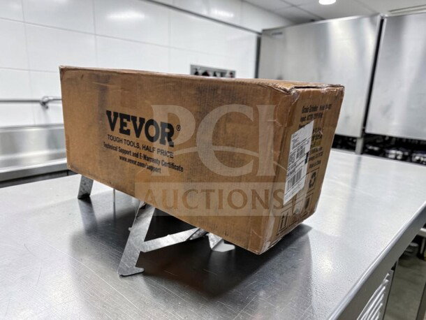 Alt text: Boxed VEVOR GM-001 Electric Grain Mill Grinder, 3000W, 110–120V, new condition with visible brand logo and support info.