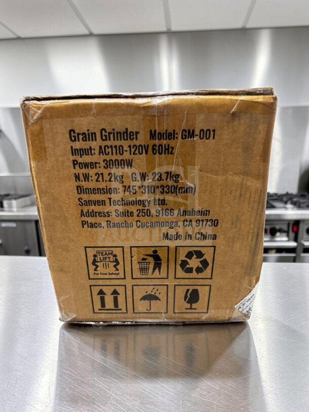 Brand new VEVOR GM-001 3000W electric grain mill grinder, model GM-001, in sealed box. Dimensions: 745x310x330mm.