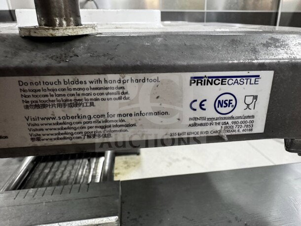 Prince Castle 980-000-00 Saber King food slicer, NSF certified, optimal condition, detailed safety and info labels visible.