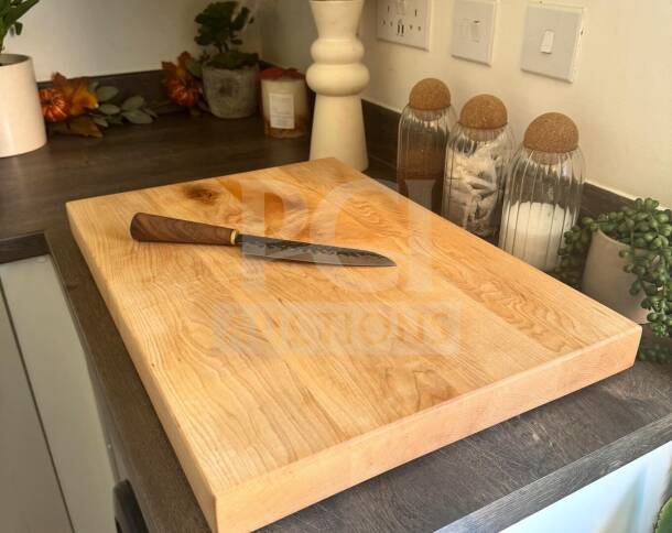 Large maple butcher block cutting board, approx. 24"x18", non-slip feet, excellent condition, suitable for chef or restaurant use.