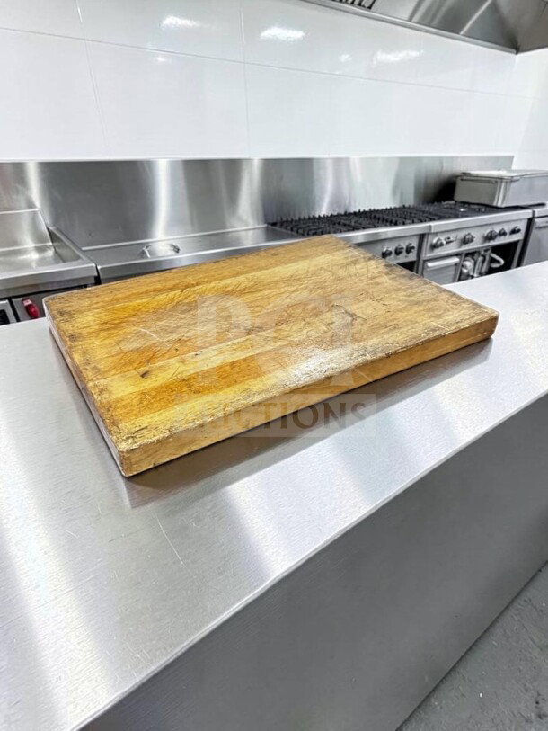 Large maple butcher block cutting board, 24" x 18", used condition, non-slip feet, suitable for restaurant use, durable.