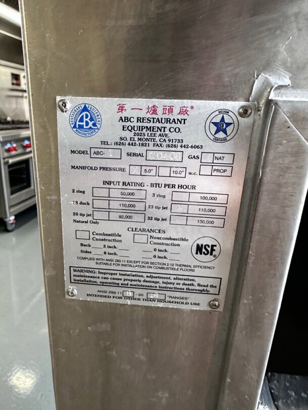 Close-up of ABC Restaurant Equipment Serial Label on Model ABC-1 Wok Range, showing NSF certification and specifications.