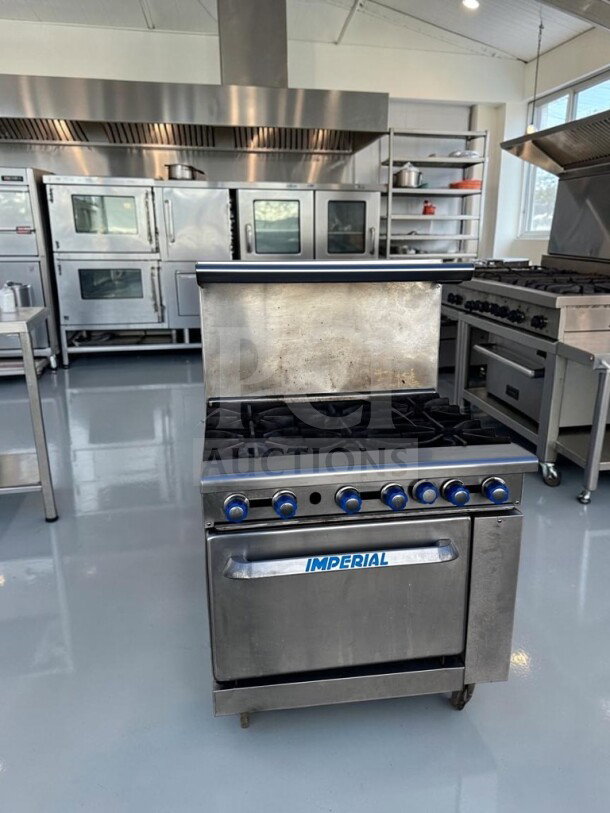Imperial IR-6 36" commercial gas range with 6 burners. Superior condition, NSF & CSA certified, 227,000 BTU, natural gas.