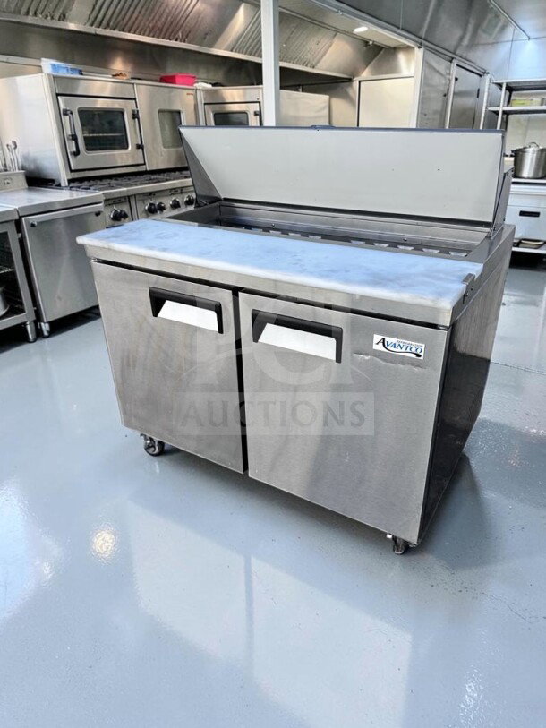 Avantco APT-48-HC 47" refrigerated prep table in elite condition, 12-pan capacity, ETL & NSF certified, 2-door design.