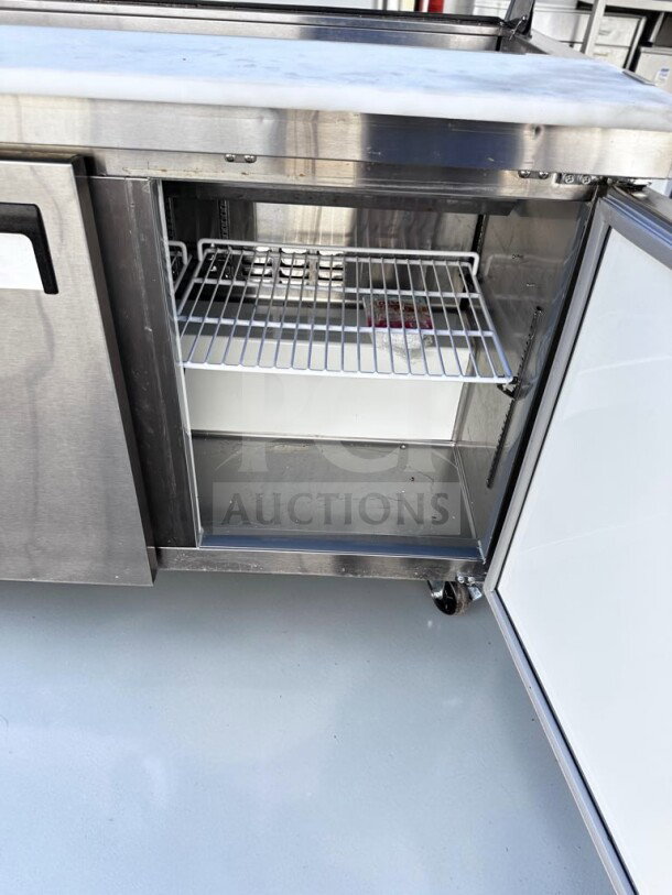 Avantco APT-48-HC 47" refrigerated prep table, stainless steel, 2-door, 12-pan capacity, ETL & NSF certified, open door view.