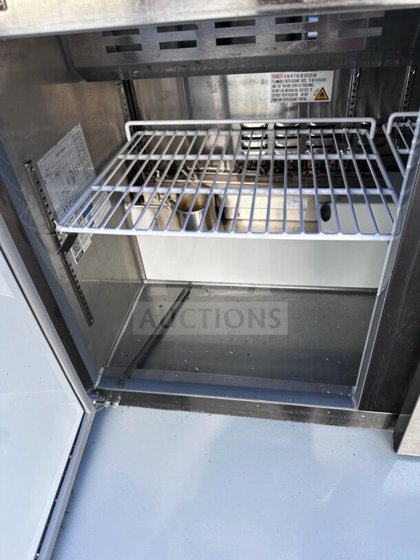 Avantco APT-48-HC refrigerated prep table interior showing clean two-door compartment with shelving, ETL & NSF certified.