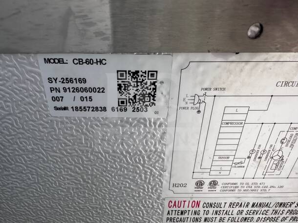 Articulated label on Cooler Depot CB60 chef base with model, serial number, and circuit diagram details, emphasizing NSF compliance.