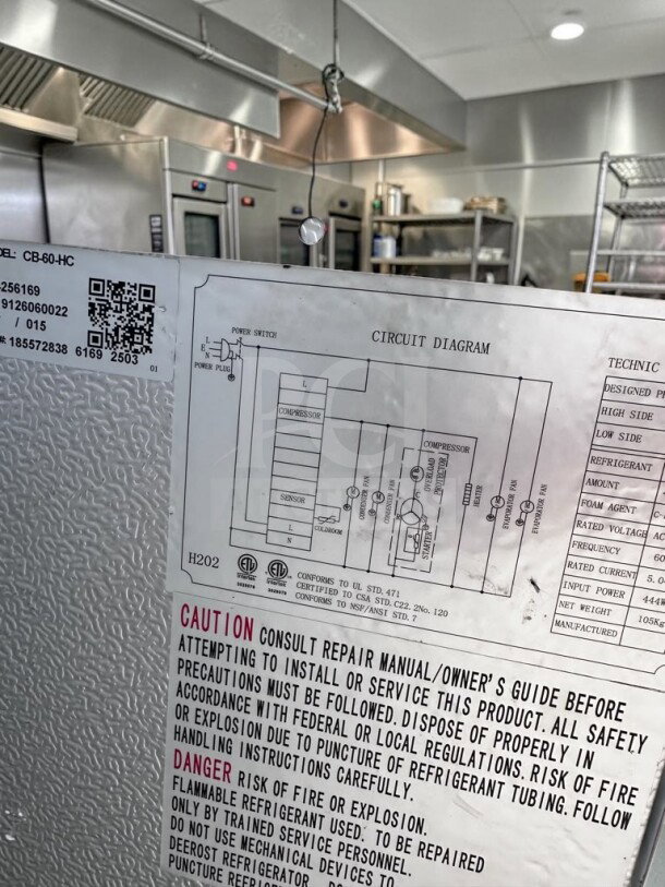 Alt text: 

Cooler Depot CB60 circuit diagram label showing electrical specifications and safety warnings in a commercial kitchen setting.
