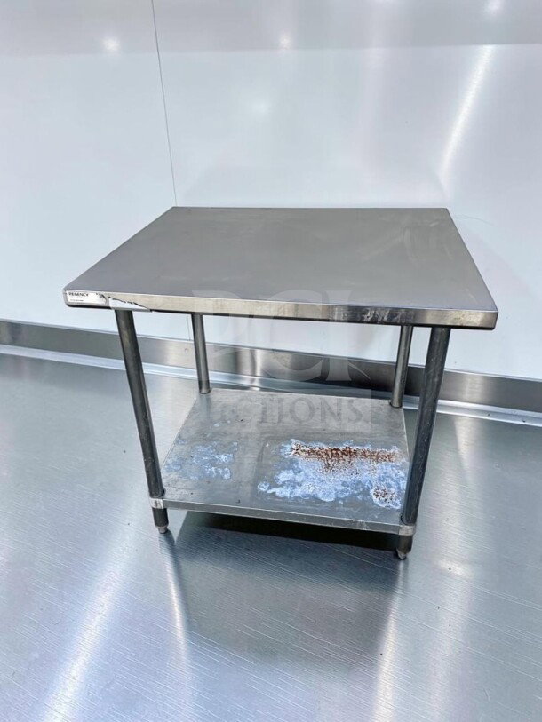 Regency 600T3036G 36"x30" stainless steel work table with galvanized undershelf, adjustable feet, NSF certified, fully inspected.