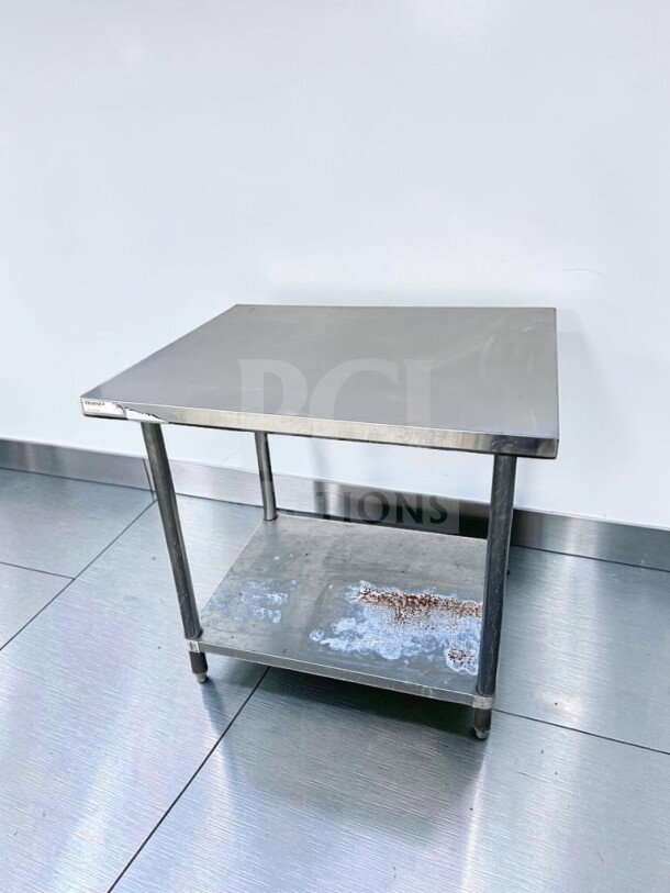 Regency 600T3036G 36" x 30" stainless steel work table with galvanized undershelf, adjustable feet, NSF certified, inspected.