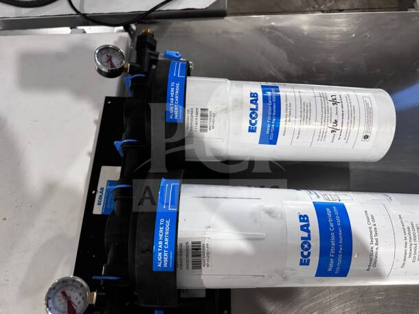 Ecolab KPMF HC614-2 dual-cartridge water filtration system, 150,000-gallon capacity, dual pressure gauges, NSF/ANSI 42 certified.