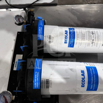 Ecolab KPMF HC614-2 dual-cartridge water filtration system, 150,000-gallon capacity, dual pressure gauges, NSF/ANSI 42 certified.