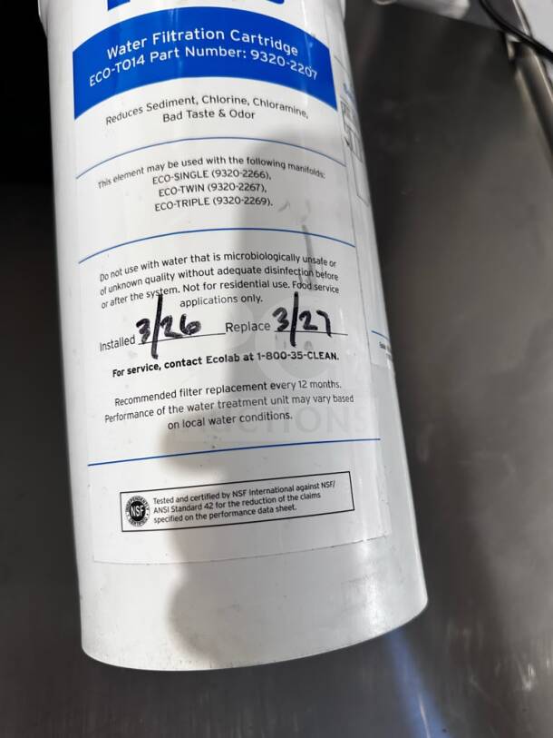 Ecolab/KineticoPRO water filtration cartridge, reduces sediment and chlorine, NSF/ANSI 42 certified, labeled with installation and replacement dates.