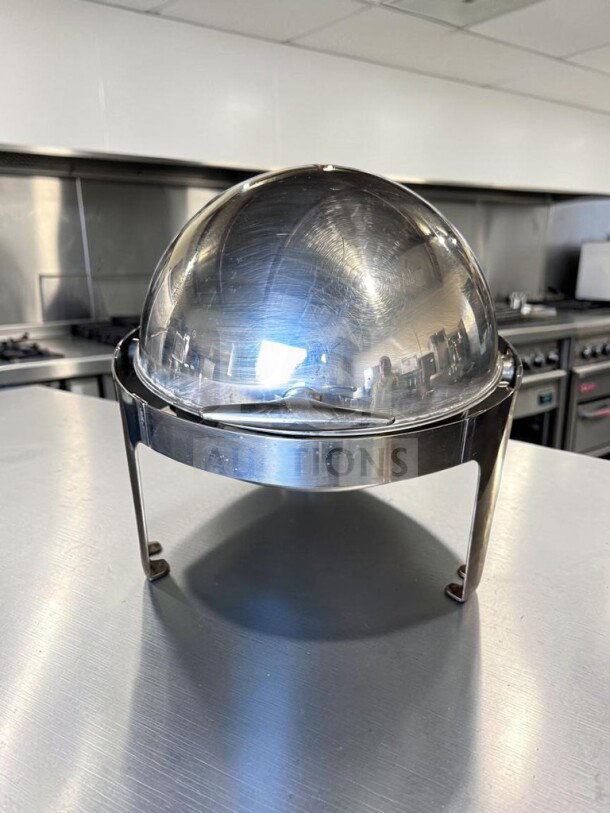 Premium condition stainless steel round roll-top chafing dish with elevated stand, removable food pan, fully inspected.