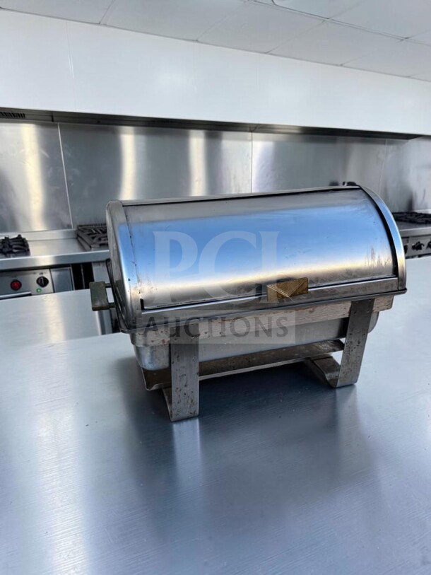 Superb condition 8 qt. stainless steel roll-top chafing dish, rectangular, unbranded, with removable food pan on metal legs.