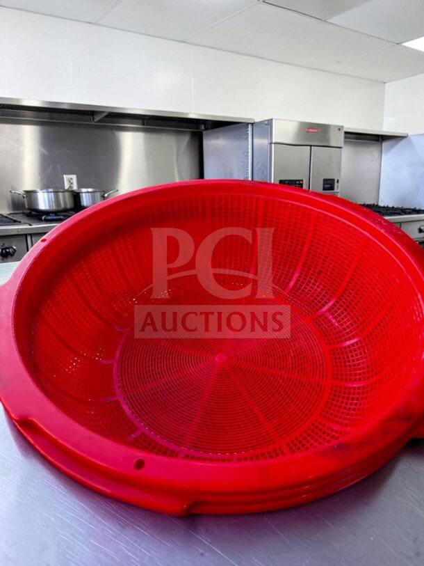 Pristine commercial 20" red plastic colander basket with integrated handles. Large-capacity, inspected, ready for use.