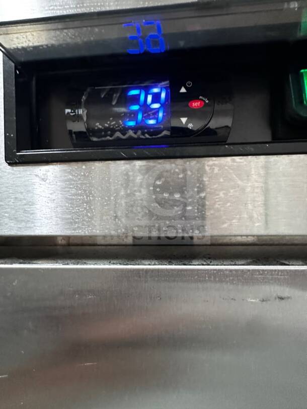 Control panel of Atosa MBF8004GR fridge showing 39°F. Stainless steel surface visible, indicating temperature settings.