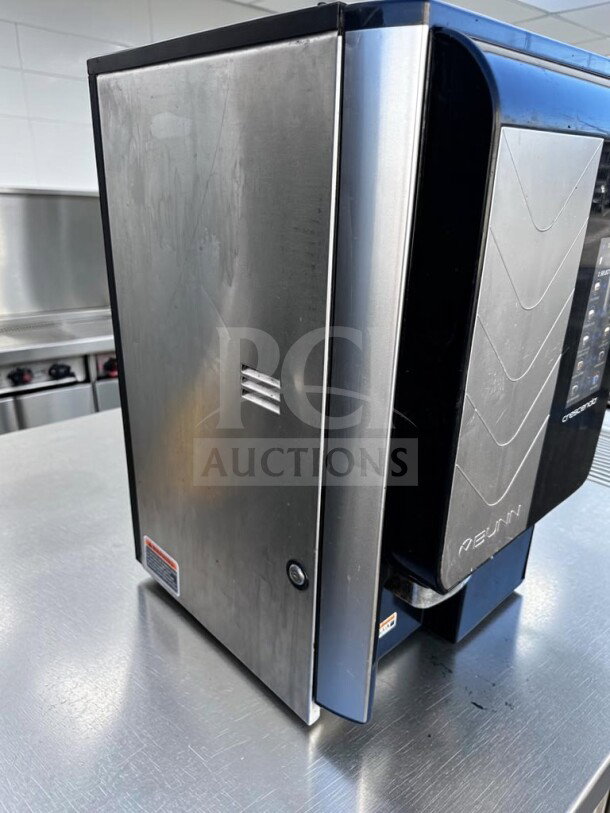 Bunn-O-Matic Crescendo 44300.0213 espresso machine, stainless steel, 9 drink options, outstanding condition, model and branding visible.