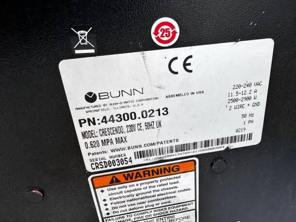 BUNN Crescendo 44300.0213 label, showing model, voltage, and safety instructions. Assembled in USA.
