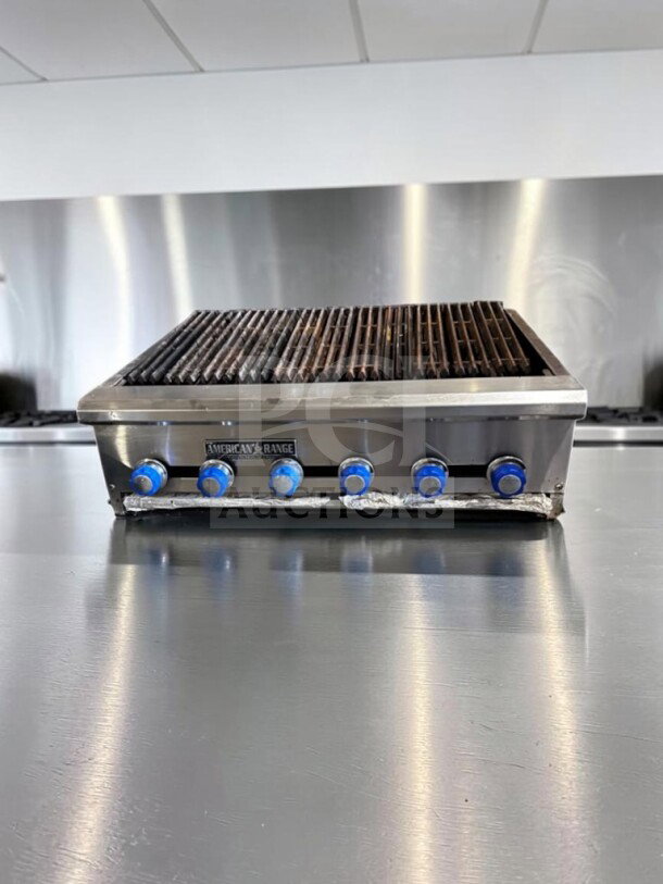 Superior condition American Range 48" radiant gas charbroiler, six burners, heavy-duty cast-iron grates, stainless steel.
