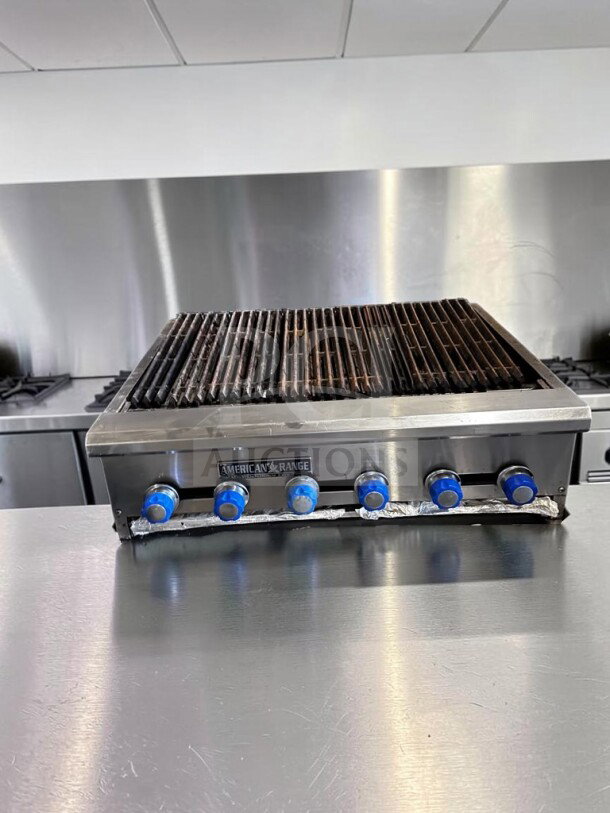 American Range 48" Radiant Gas Charbroiler, stainless steel, six burners, cast-iron grates, fully tested, excellent condition.