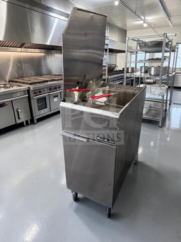 Blue Lava BLF3-NG 40 lb. natural gas floor fryer; stainless steel; 90,000 BTU; CSA certified; excellent condition.