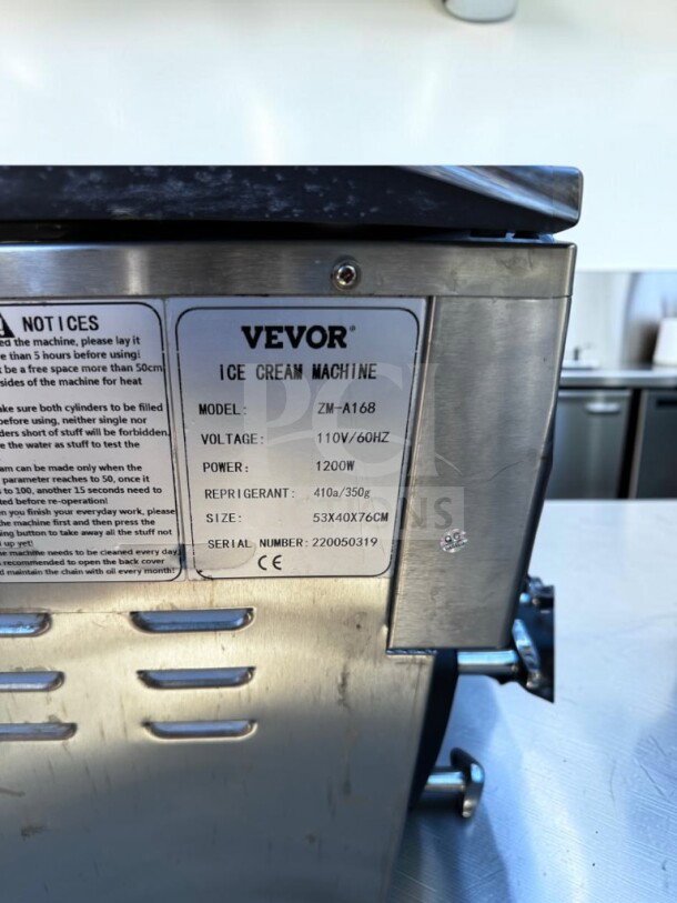 VEVOR ZM-A168 ice cream machine label, 110V, 1200W, 53x40x76cm, CE marked, like-new condition, fully operational.