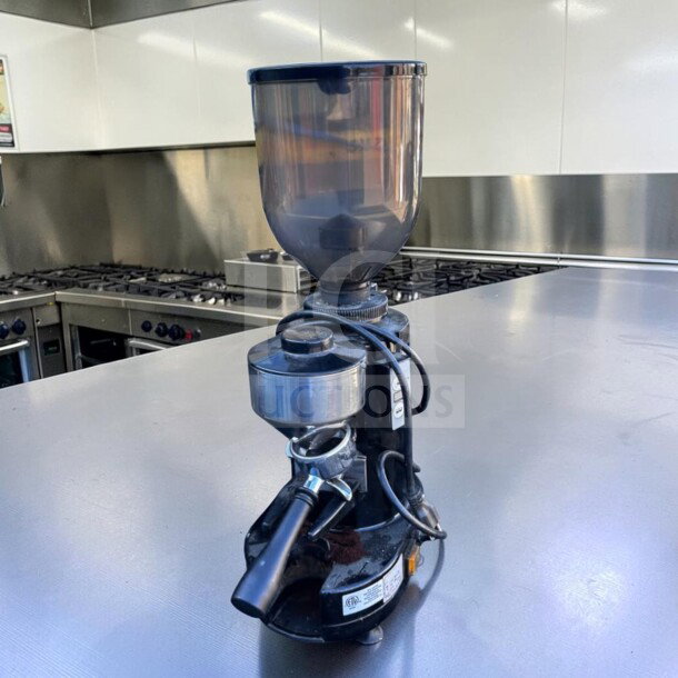 Gino Rossi RR45 espresso grinder with doser, 1.2 kg hopper, 63.5 mm flat burrs, 120V, excellent condition, commercial kitchen setting.