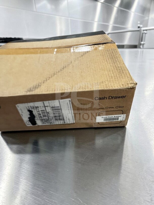 New open box Toast TC200 commercial black POS cash drawer. Lockable with key, removable cash till, printer-driven connection.
