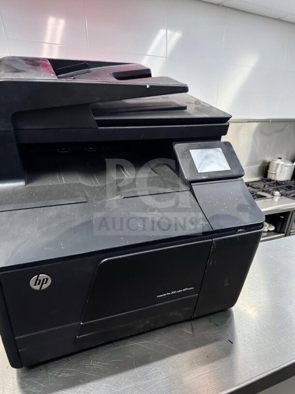 HP LaserJet Pro 200 Color MFP M276nw printer, well-maintained, features 3.5" touchscreen, automatic document feeder, wireless.