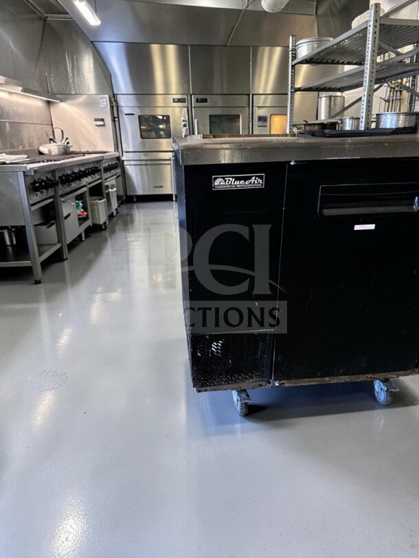 Blue Air BBB59-2B 59" back bar cooler, black exterior, stainless steel top, two solid locking doors, excellent condition.