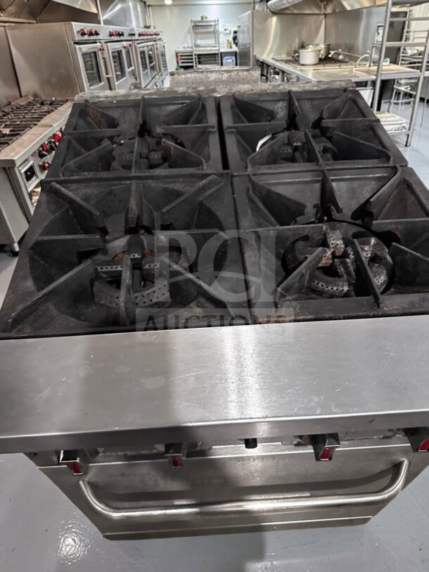 Kintera KR4 24" commercial natural gas range with four 30,000 BTU open burners and standard oven. Fully operational.