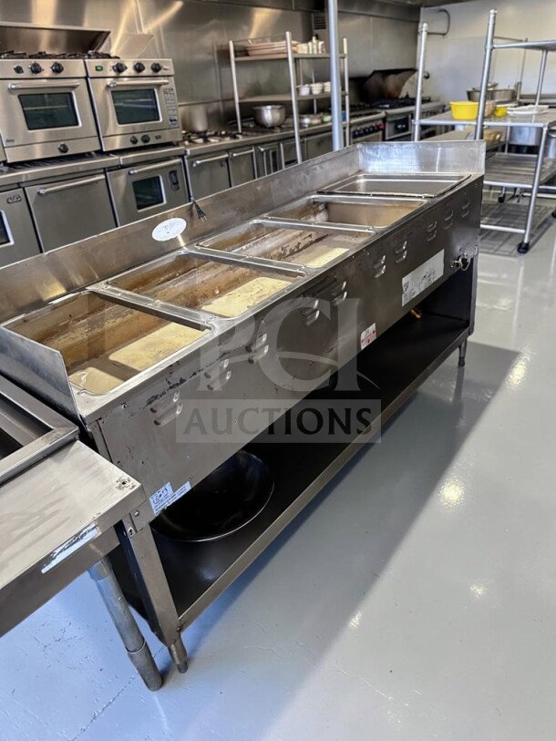 Optimal Condition Duke 305 Aerohot hot food table with five full-size wells, stainless steel base, and undershelf. Fully tested.