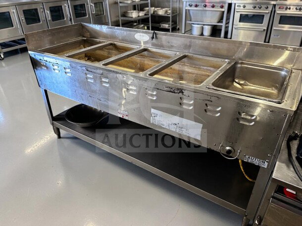 Duke 305 Aerohot 72-3/8" commercial gas hot food table with five wells, stainless steel base, 12,500 BTU, tested operational.