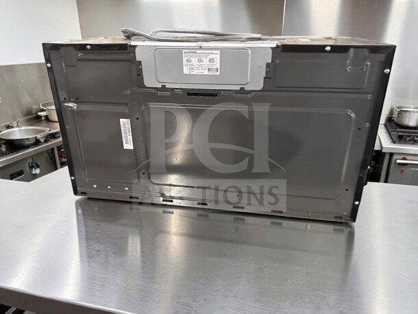 GE Profile PVM9215SK6SS microwave, stainless steel, 30", 2.1 cu. ft., 1,000W, new/open box, back view.