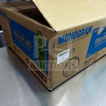 Cardboard box labeled "Monogram Cleaning Disposables" containing 1,000 compostable cold cup lids. New condition.